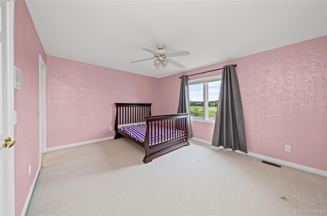 2401 Spyglass Dr, Oakland, MI 48363 - unfurnished bedroom featuring carpet flooring and a ceiling fan