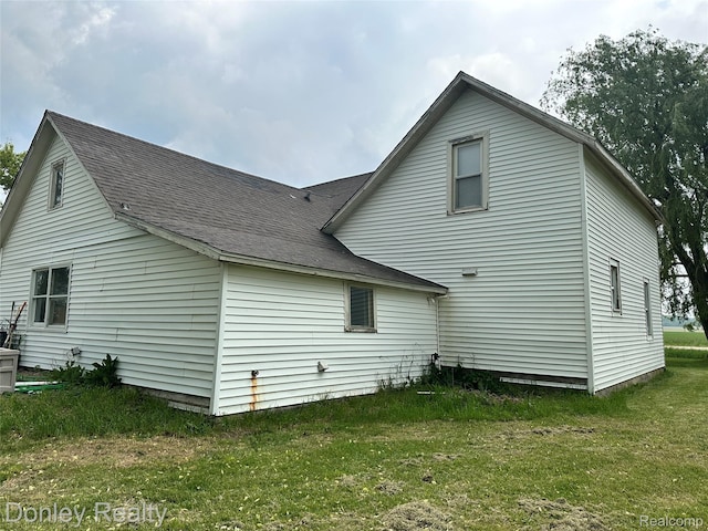 1286 Elmer Rd, Sandusky, MI 48471 - rear view of property with a lawn and roof with shingles