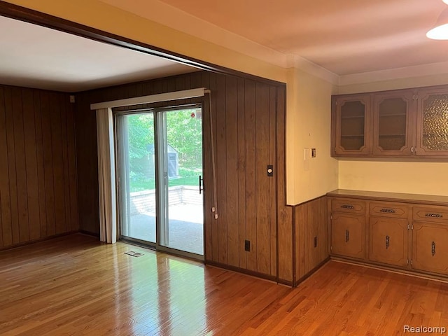 2763 Ranieri Dr, Troy, MI 48085 - unfurnished room with wood walls and light wood-style flooring
