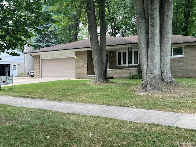 2763 Ranieri Dr, Troy, MI 48085 - view of front facade featuring brick siding, a garage, a front yard, and concrete driveway