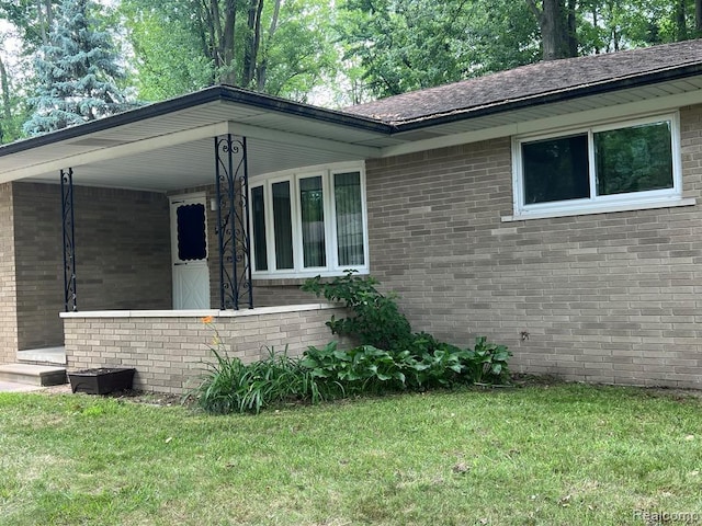 2763 Ranieri Dr, Troy, MI 48085 - view of home's exterior featuring a yard and brick siding