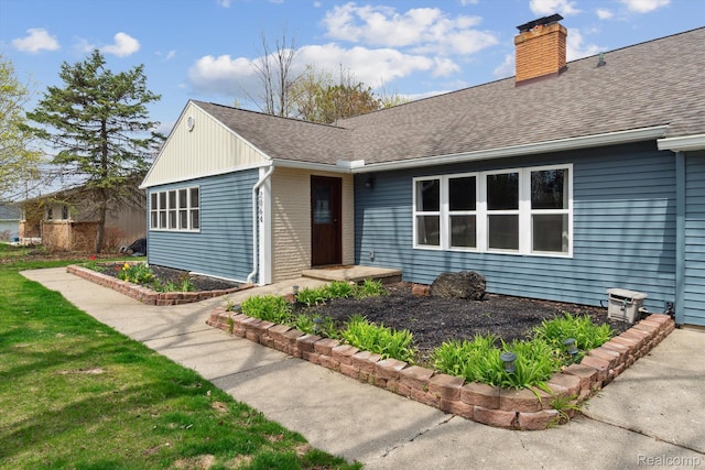 2064 N Long Lake Rd, Fenton, MI 48430 - view of front facade with a chimney and roof with shingles