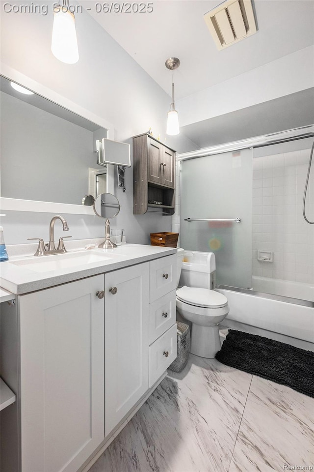 4483 Laurel Club Cir W, Bloomfield, MI 48323 - bathroom featuring vanity, toilet, combined bath / shower with glass door, and marble look tile flooring