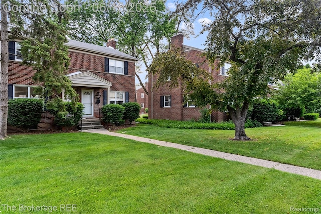 3344 Coolidge Hwy, Royal Oak, MI 48073 - view of front of home featuring brick siding, a chimney, and a front lawn