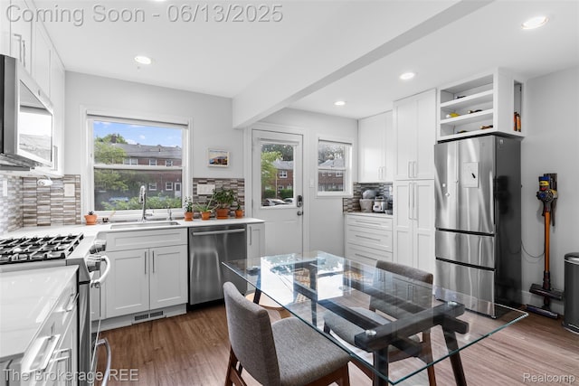 3344 Coolidge Hwy, Royal Oak, MI 48073 - kitchen featuring appliances with stainless steel finishes, healthy amount of natural light, backsplash, dark wood-type flooring, and recessed lighting