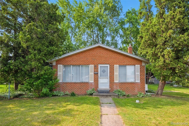 13332 Masonic Blvd, Warren, MI 48088 - bungalow-style home featuring brick siding and a chimney