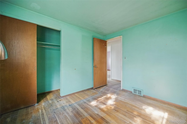 13332 Masonic Blvd, Warren, MI 48088 - unfurnished bedroom with wood finished floors, a closet, and baseboards