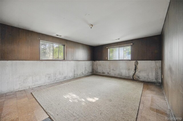 13332 Masonic Blvd, Warren, MI 48088 - unfurnished room featuring healthy amount of natural light, light floors, and wood walls
