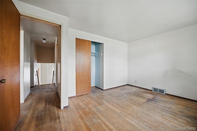 13332 Masonic Blvd, Warren, MI 48088 - unfurnished bedroom featuring hardwood / wood-style floors, baseboards, and a closet