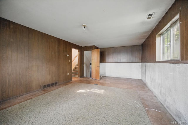 13332 Masonic Blvd, Warren, MI 48088 - spare room featuring stairway and wooden walls