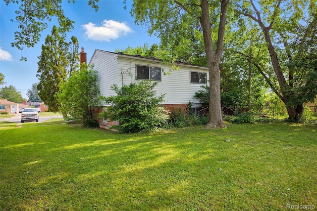 13332 Masonic Blvd, Warren, MI 48088 - view of side of property with a yard and a chimney
