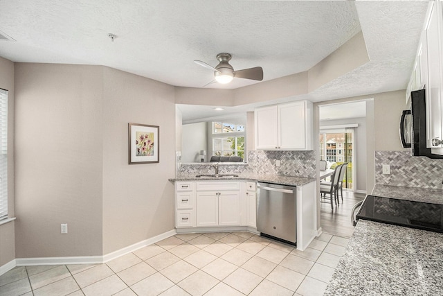 1599 Weatherstone Dr Unit 245, Ann Arbor, MI 48108 - kitchen featuring stainless steel appliances, a sink, backsplash, ceiling fan, and white cabinets
