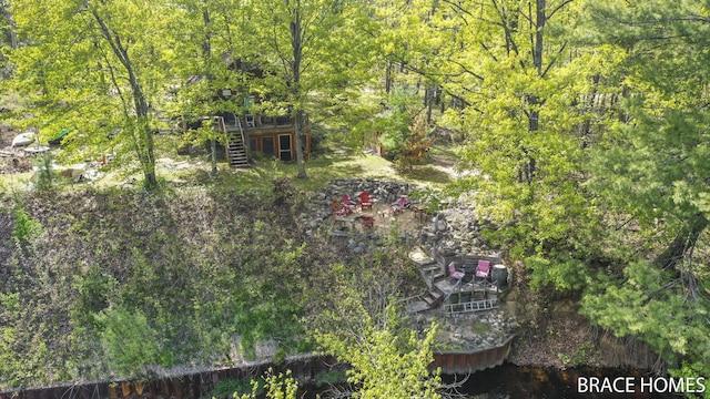4553 S Paradise Rd, Merritt, MI 49667 - view of yard with stairway and a deck