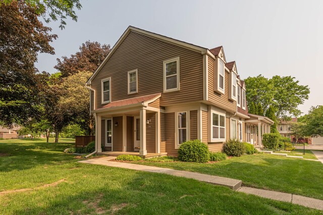 2705 Winthrop Ct, Ann Arbor, MI 48104 - view of front of home featuring covered porch and a front lawn