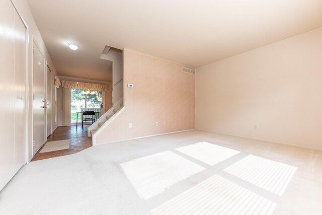 2705 Winthrop Ct, Ann Arbor, MI 48104 - spare room featuring light colored carpet and stairway