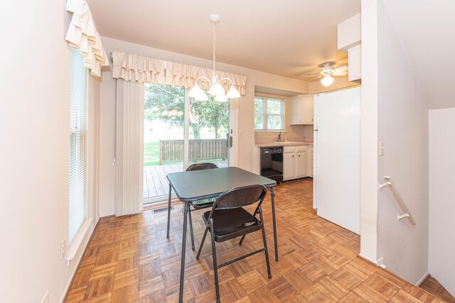2705 Winthrop Ct, Ann Arbor, MI 48104 - dining room featuring a ceiling fan and a chandelier