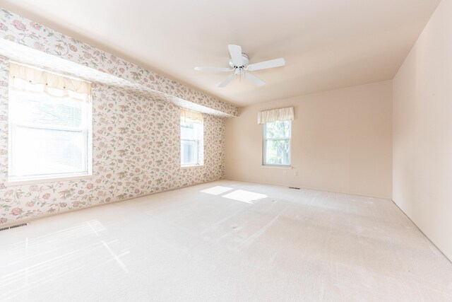 2705 Winthrop Ct, Ann Arbor, MI 48104 - carpeted spare room featuring wallpapered walls and ceiling fan