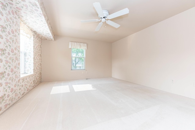 2705 Winthrop Ct, Ann Arbor, MI 48104 - carpeted spare room with wallpapered walls and ceiling fan