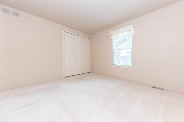 2705 Winthrop Ct, Ann Arbor, MI 48104 - unfurnished bedroom with carpet and a closet