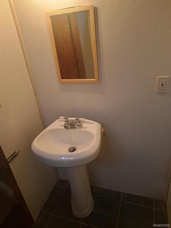 4510 Croissant St, Allen Park, MI 48125 - bathroom with tile patterned flooring and a sink