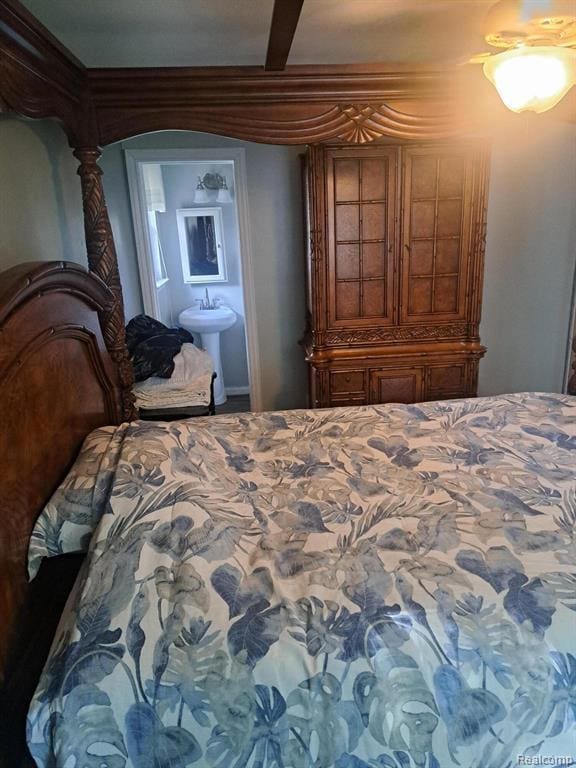 4510 Croissant St, Allen Park, MI 48125 - bedroom with a sink, connected bathroom, and arched walkways