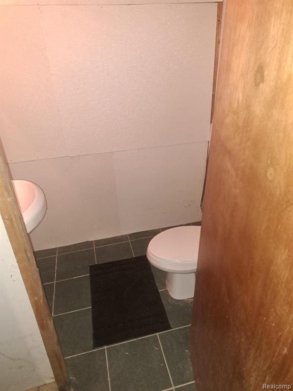 4510 Croissant St, Allen Park, MI 48125 - bathroom featuring tile patterned floors and toilet