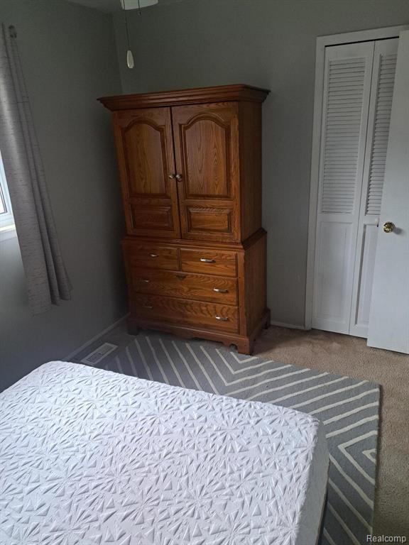 4510 Croissant St, Allen Park, MI 48125 - bedroom with carpet floors and a closet