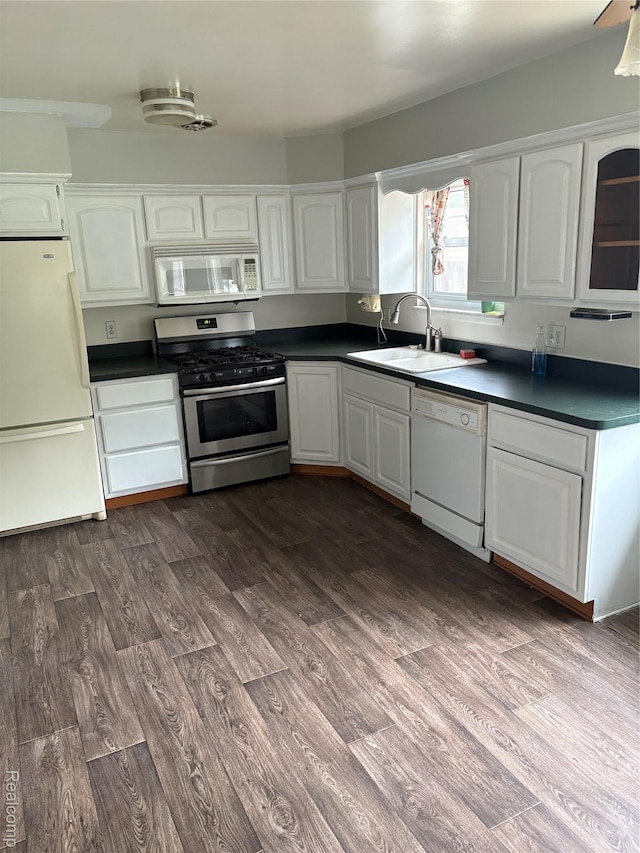 4510 Croissant St, Allen Park, MI 48125 - kitchen featuring white appliances, a sink, white cabinets, dark wood-type flooring, and dark countertops