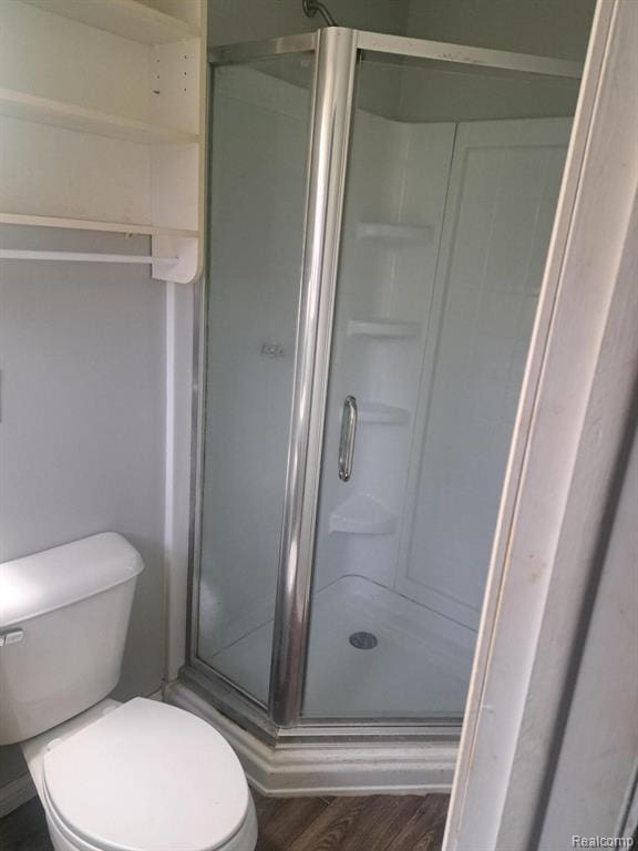 4510 Croissant St, Allen Park, MI 48125 - full bath with a shower stall, toilet, and wood finished floors