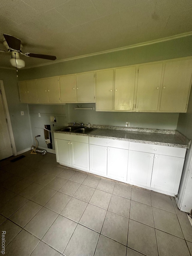 811 Robinwood St, Pontiac, MI 48340 - kitchen with a sink, light tile patterned floors, ceiling fan, crown molding, and cream cabinets