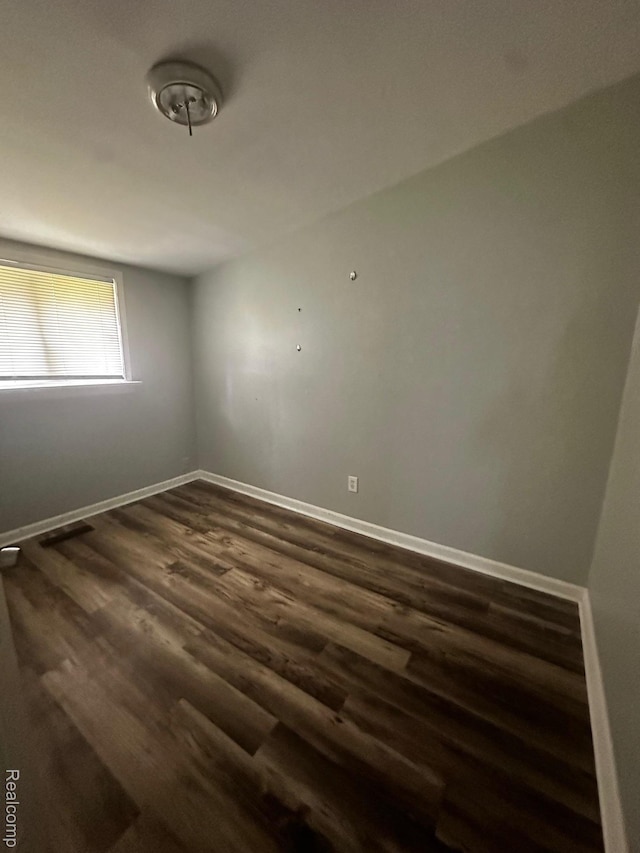 811 Robinwood St, Pontiac, MI 48340 - spare room with dark wood-style floors and baseboards