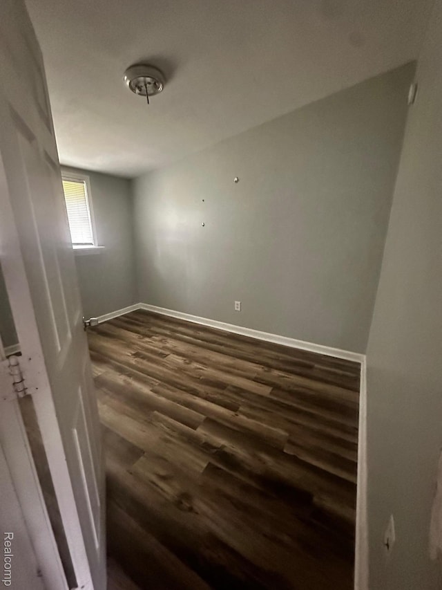 811 Robinwood St, Pontiac, MI 48340 - unfurnished room with dark wood-style flooring and baseboards