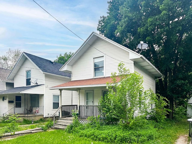 611 E Mount Hope Ave, Lansing, MI 48910 - view of front of property featuring covered porch