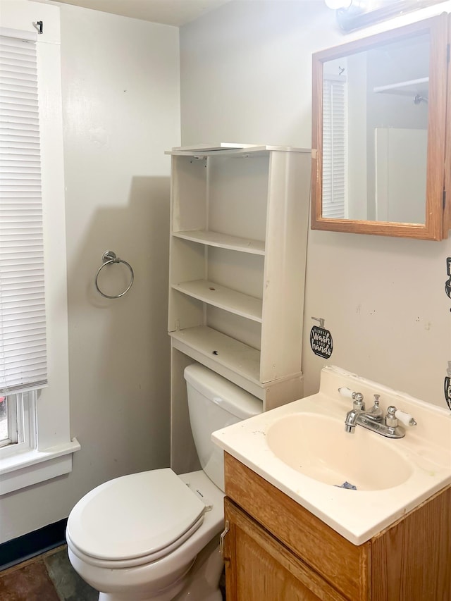 611 E Mount Hope Ave, Lansing, MI 48910 - bathroom featuring vanity and toilet