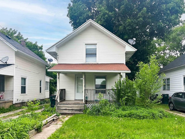 611 E Mount Hope Ave, Lansing, MI 48910 - view of front of house featuring a porch
