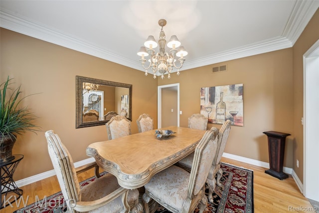 14163 Longneedle Ct, Shelby Twp, MI 48315 - dining space featuring a chandelier, crown molding, and light wood-style flooring