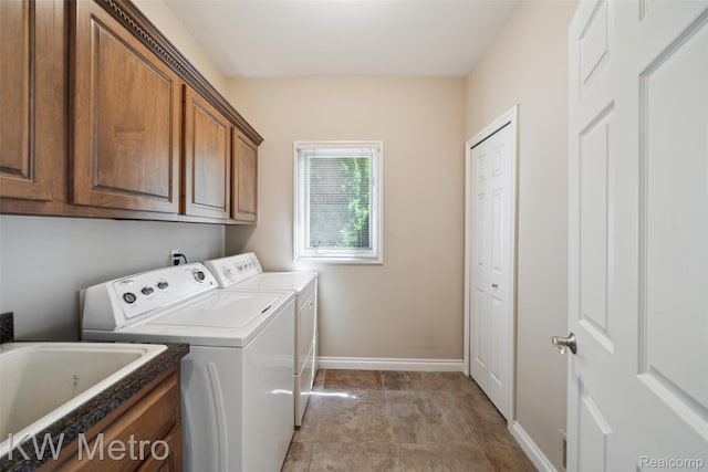 14163 Longneedle Ct, Shelby Twp, MI 48315 - laundry room featuring independent washer and dryer and cabinet space