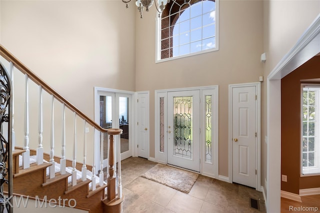 14163 Longneedle Ct, Shelby Twp, MI 48315 - tiled foyer entrance with stairs and a high ceiling
