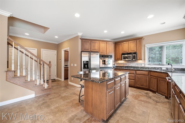 14163 Longneedle Ct, Shelby Twp, MI 48315 - kitchen with appliances with stainless steel finishes, a center island, brown cabinets, a breakfast bar, and recessed lighting