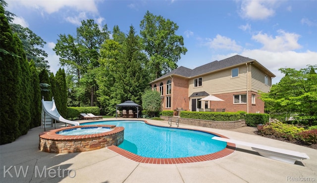 14163 Longneedle Ct, Shelby Twp, MI 48315 - view of pool with a water slide, a diving board, a gazebo, a patio area, and a pool with connected hot tub