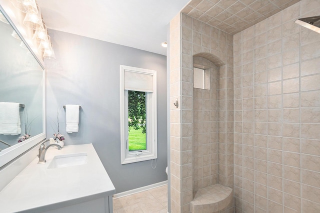 565 Hawksnest Dr, South Haven, MI 49090 - full bathroom with vanity, a tile shower, baseboards, and tile patterned floors