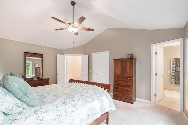 565 Hawksnest Dr, South Haven, MI 49090 - bedroom featuring light carpet, lofted ceiling, a ceiling fan, a closet, and ensuite bath