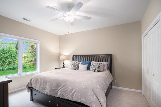 565 Hawksnest Dr, South Haven, MI 49090 - carpeted bedroom with a closet, baseboards, and a ceiling fan