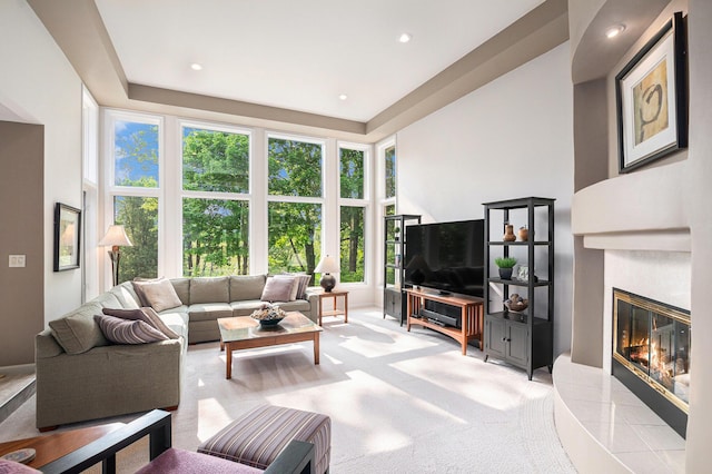 565 Hawksnest Dr, South Haven, MI 49090 - living room featuring a glass covered fireplace, recessed lighting, and a towering ceiling