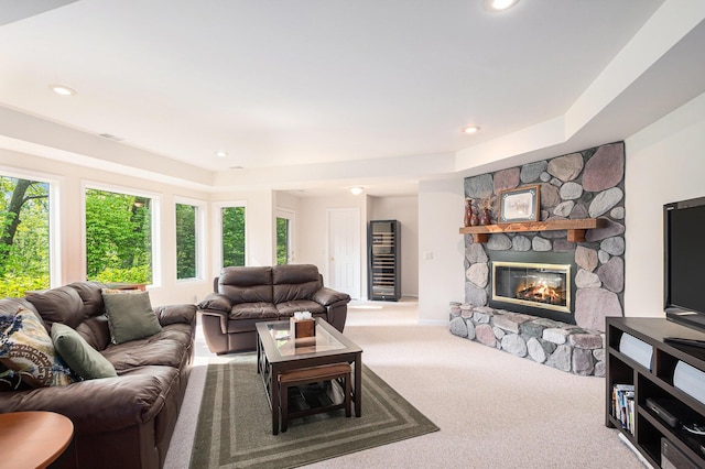 565 Hawksnest Dr, South Haven, MI 49090 - living area with carpet floors, a stone fireplace, recessed lighting, and a raised ceiling