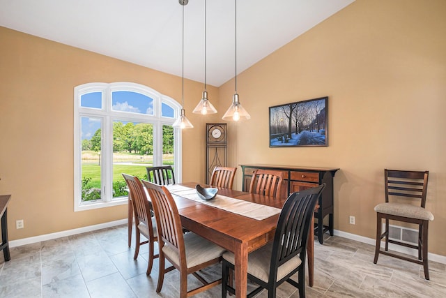 565 Hawksnest Dr, South Haven, MI 49090 - dining room featuring baseboards and high vaulted ceiling