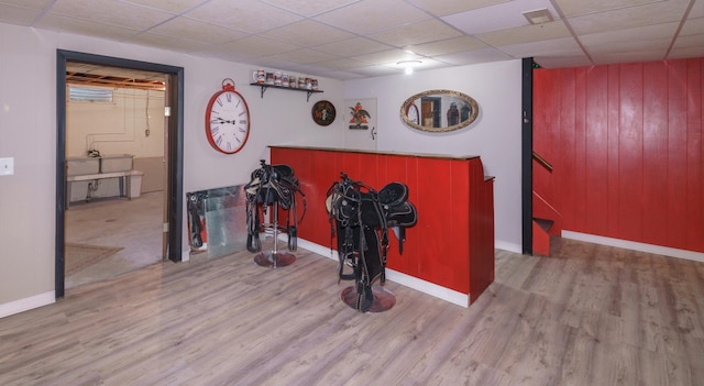 4143 Browning Dr, Saint Joseph, MI 49085 - bar with wood finished floors, a paneled ceiling, wooden walls, and baseboards