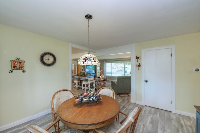 4143 Browning Dr, Saint Joseph, MI 49085 - dining space featuring light wood-style floors and baseboards