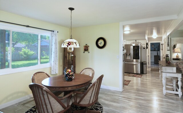 4143 Browning Dr, Saint Joseph, MI 49085 - dining room featuring baseboards and light wood-type flooring