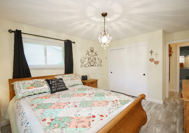 4143 Browning Dr, Saint Joseph, MI 49085 - bedroom featuring light wood-style flooring, a closet, and baseboards